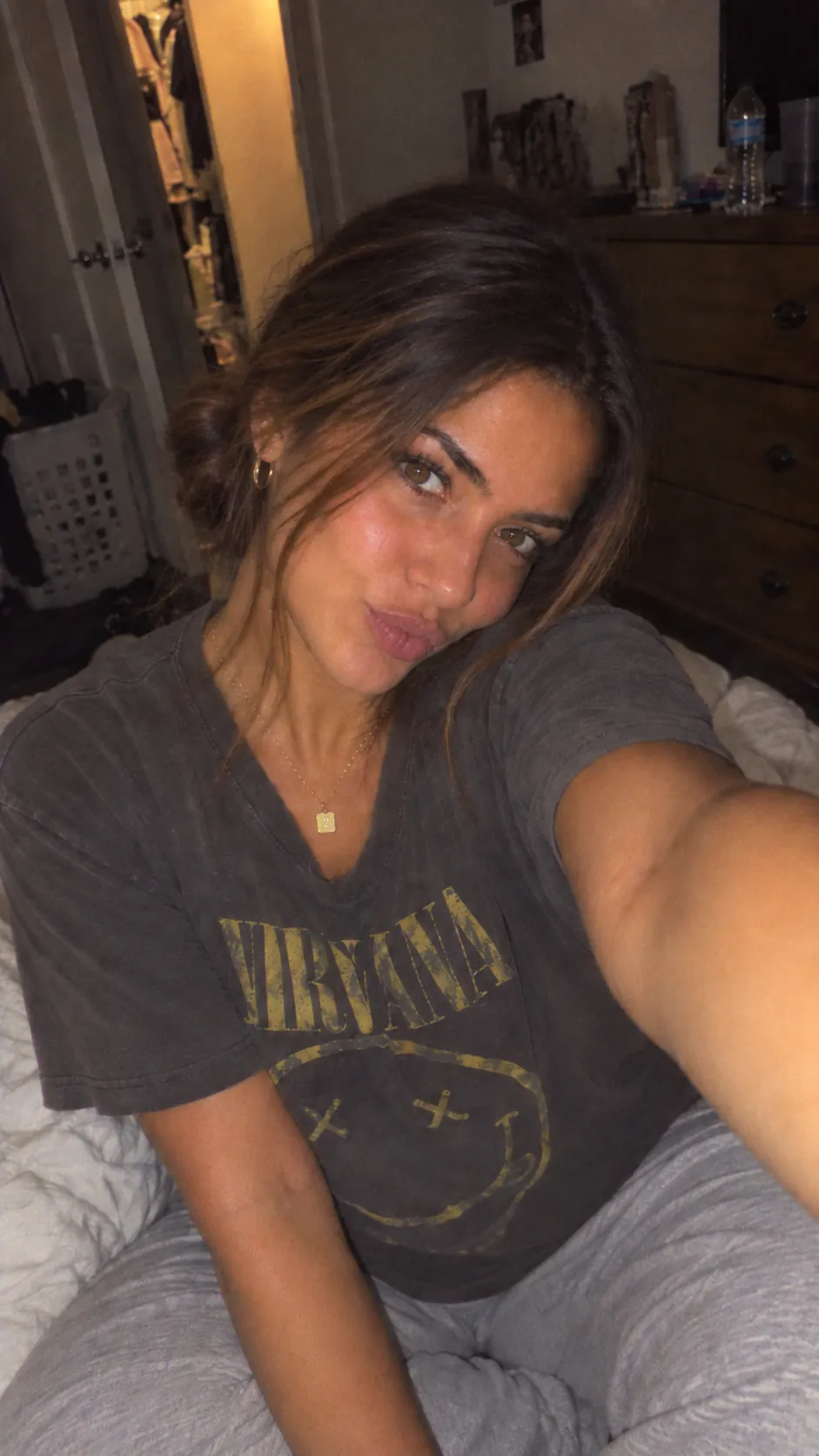 Bedroom selfie in a faded band T-shirt