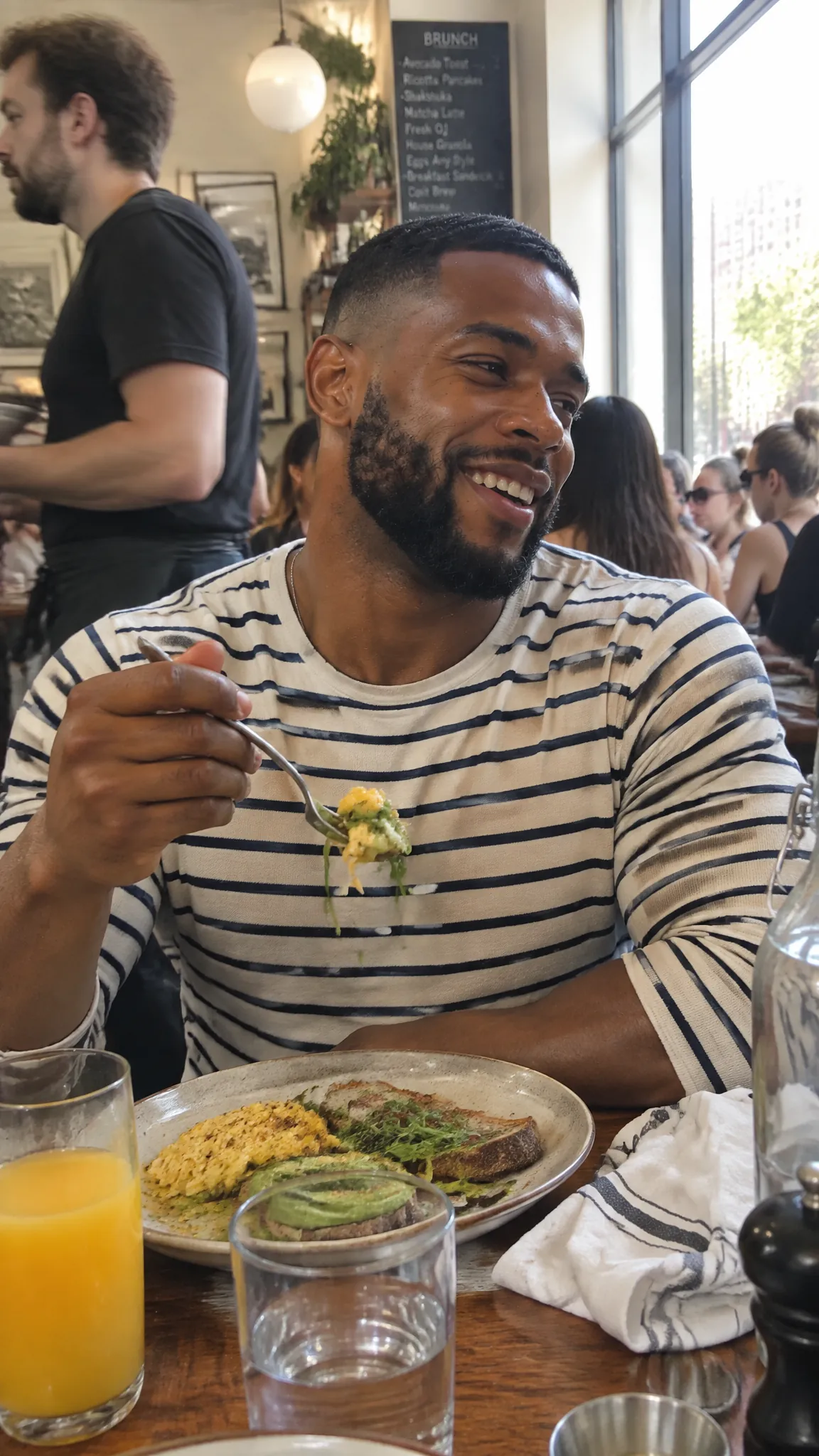 Laughing over brunch in a sunlit cafe