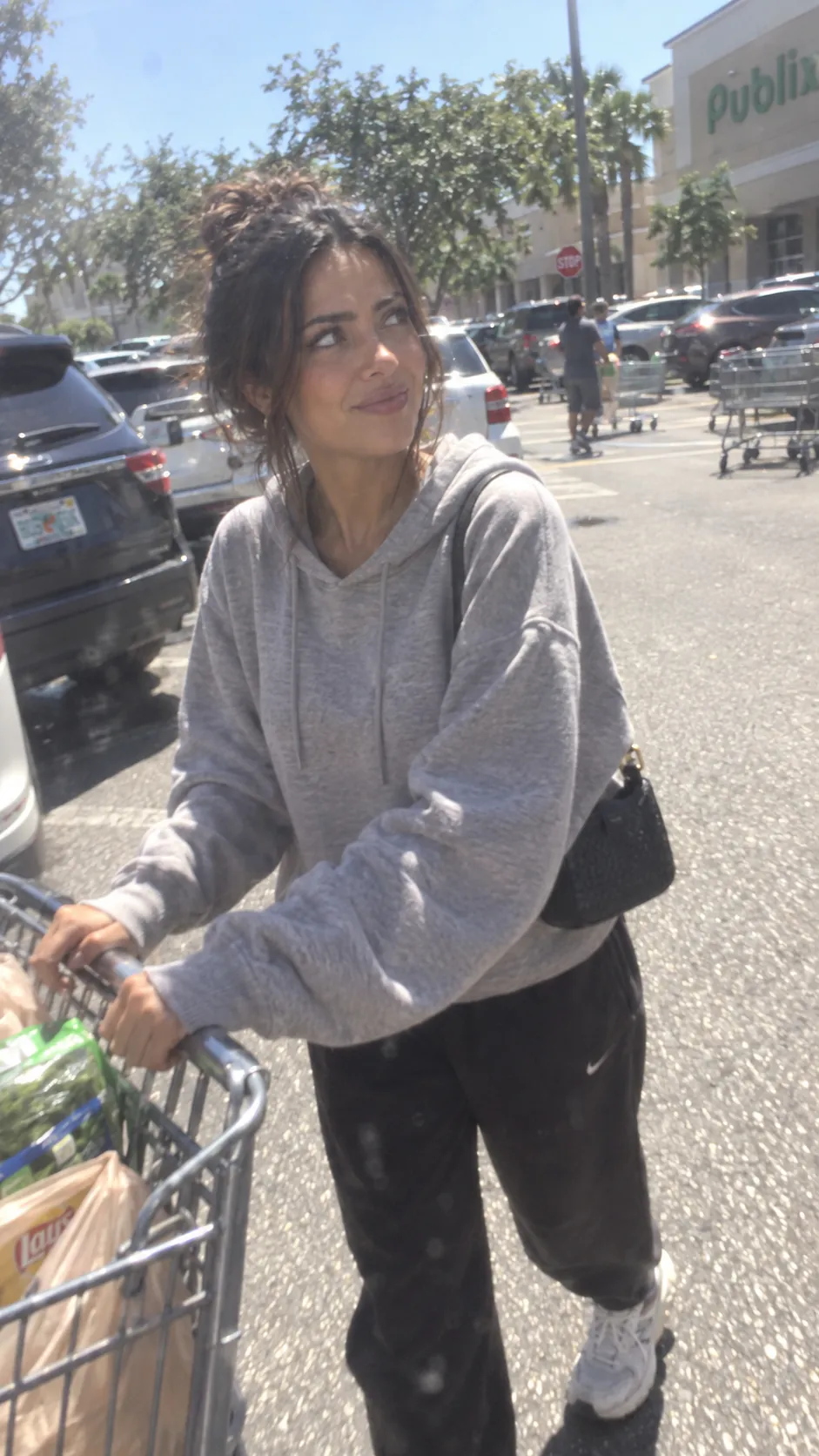 Pushing a trolley across a supermarket car park